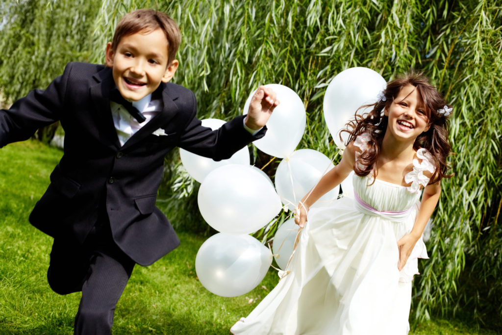 kids running at wedding - wedding guest list