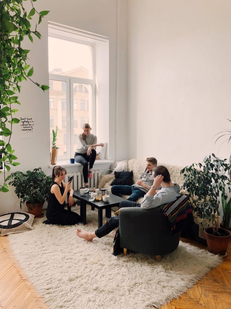 two couples sitting in house