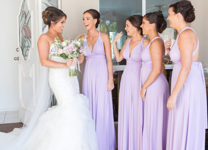 Wedding Planning Pain Points - Bridesmaid Budgeting - Bridesmaids Wearing Lavender Dresses