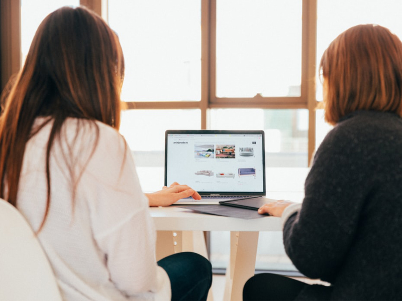 Online Wedding Shopping - Two Women Using Laptop