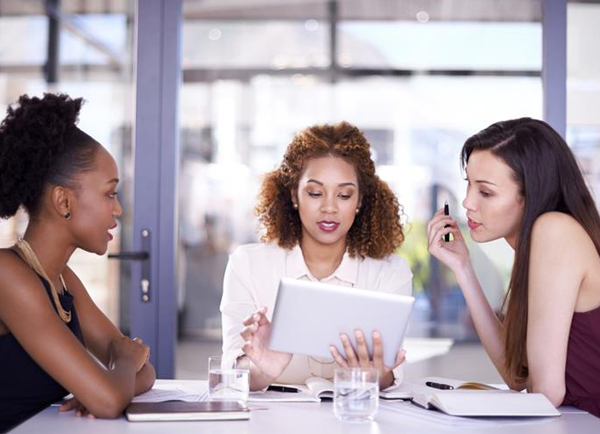 Graduation Party Ideas - Three Women Planning At Desk